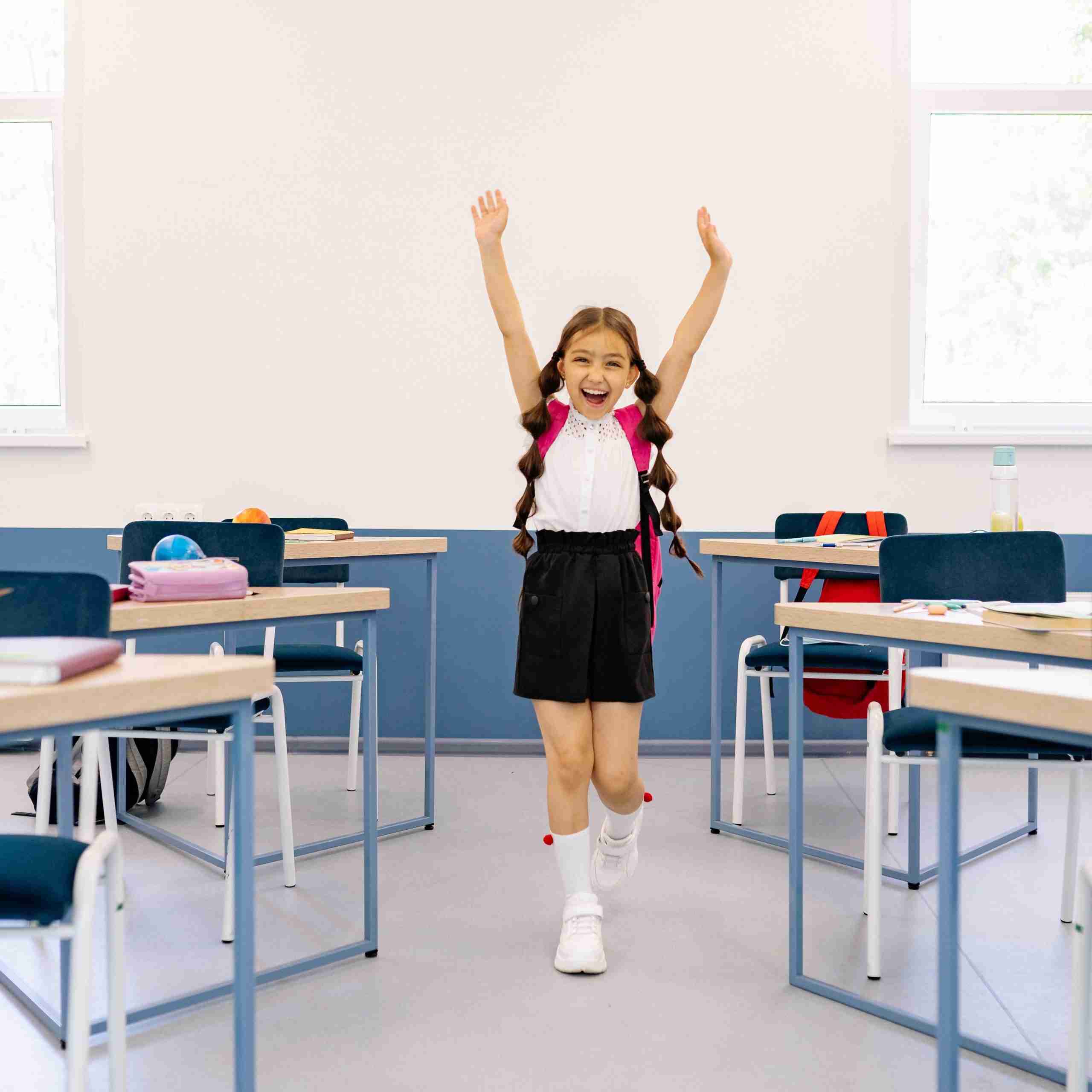 A child who is excited in a classroom setting